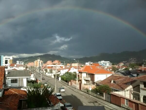 picture of rainbow and green hills in Cuenca Ecuador - How to Travel &amp; Invest In Real Estate – 10 Essential Tools of the Trade