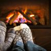 FIRE with Real Estate: Using Rentals & Leverage to Build Income Faster Feet warming by fireplace