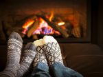 FIRE with Real Estate: Using Rentals & Leverage to Build Income Faster Feet warming by fireplace