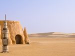 The Definition of Financial Success is Not So Obvious Tataouine scenery on a background of sand dunes.