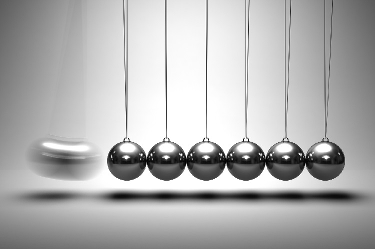 Create lifetime income for your retirement. Black and white photo of Newton's cradle, depicting perpetual motion.