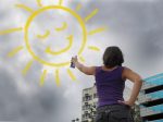 Gratitude, Optimism, and Investment Opportunities optimism and creativity: woman painting the sun onto the cloudy sky