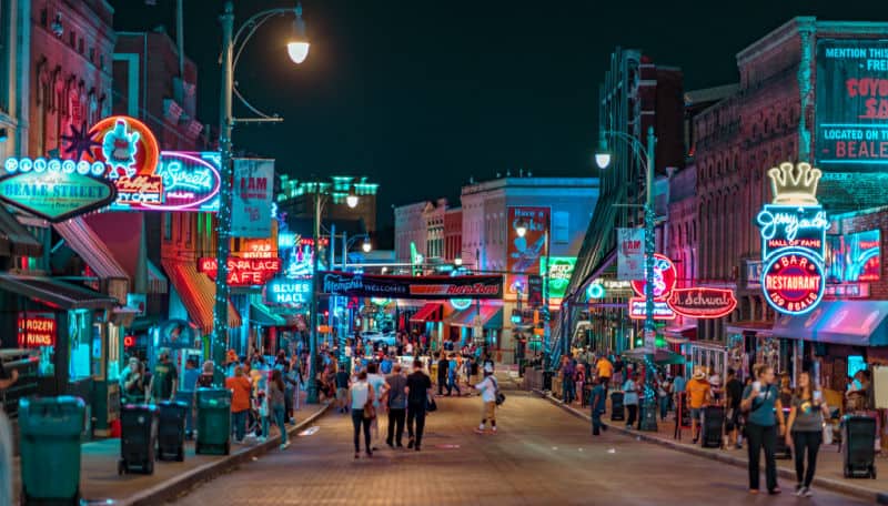 Night photo of Beale Street in Memphis, where the author owns out-of-state rental properties.