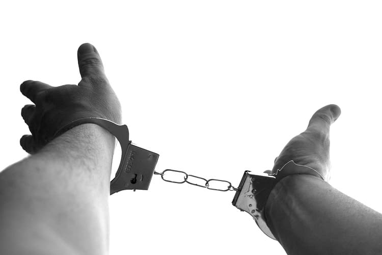 Picture of hands in handcuffs. My spouse and I talk about buying a more expensive home. But I won't let an oppressive mortgage inhibit my chances of early retirement.