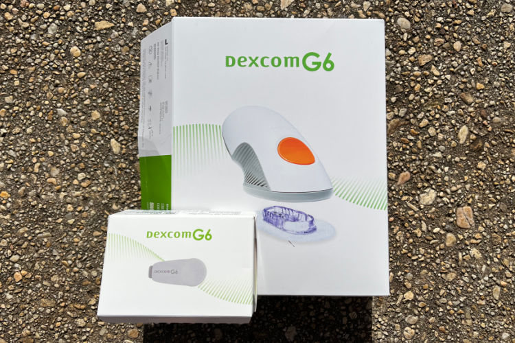 Picture of Dexcom G6 3-pack box and transmitter.