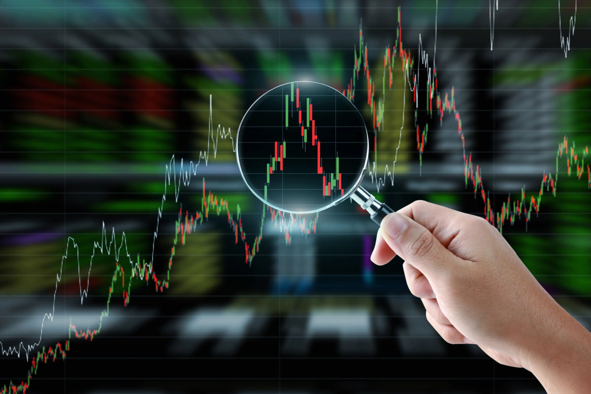 Magnifying glass investigating why IRA returns are disappointing.