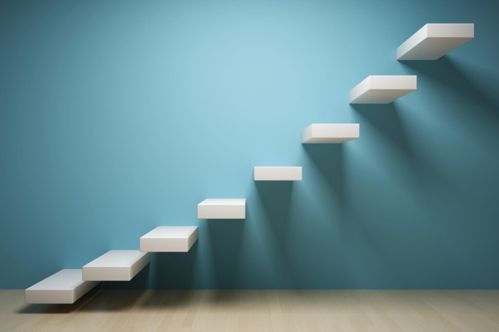 Image of floating staircase with blue wall and abstract shadows.